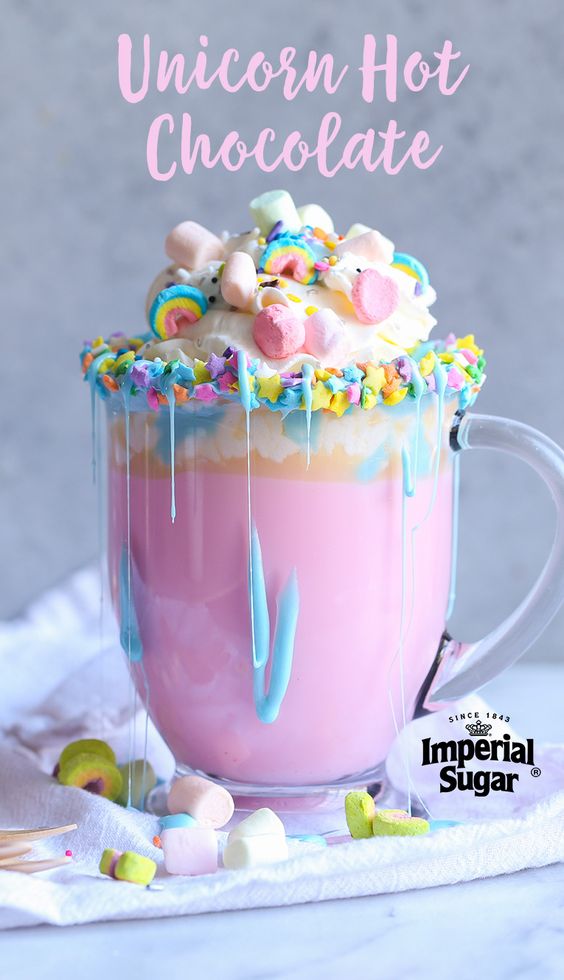 Unicorn Hot Chocolate - A magical pastel rainbow of color, fluffy mini marshmallows and a warm and creamy white chocolate. This quick and easy recipe would make a great surprise beverage for a cold winter day or a tasty sweet treat for a special birthday party or celebration.