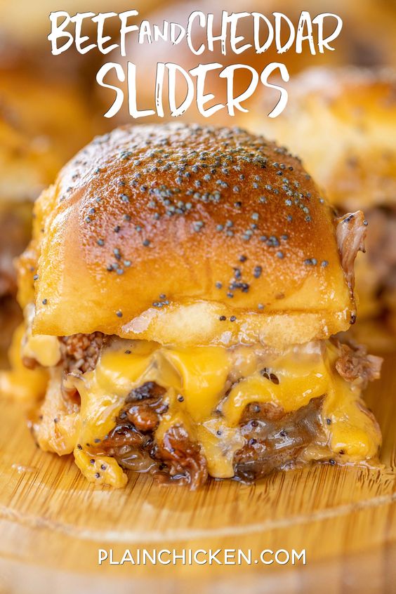 Beef & Cheddar Sliders - perfect for watching football, parties or a quick lunch and dinner. Seriously delicious!! Hawaiian rolls, deli roast beef, bbq sauce, cheddar cheese, butter, dijon mustard, worcestershire, brown sugar and poppy seeds. Can assemble ahead of time and bake when ready to serve. You might want to double the recipe - these don't last long in our house! 