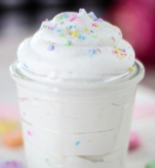 Add THIS to your Valentine's Day dessert! Conversation Heart Whipped Cream #whippedcream #homemadewhippedcream #whippedcreamrecipe #candyhearts #conversationhearts #valentinesday