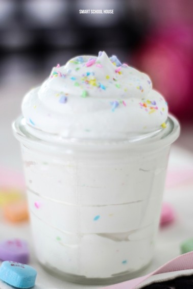 Add THIS to your Valentine's Day dessert! Conversation Heart Whipped Cream #whippedcream #homemadewhippedcream #whippedcreamrecipe #candyhearts #conversationhearts #valentinesday