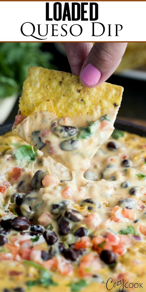 Loaded Queso Dip Recipe -This easy Homemade Queso Dip is loaded with melted Velveeta, pepper jack cheese, beef, pale ale, Rotel tomatoes, black beans, and fresh cilantro.