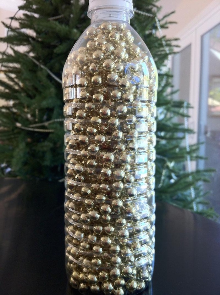 Pour Garland in a Plastic Bottle to Prevent Tangling