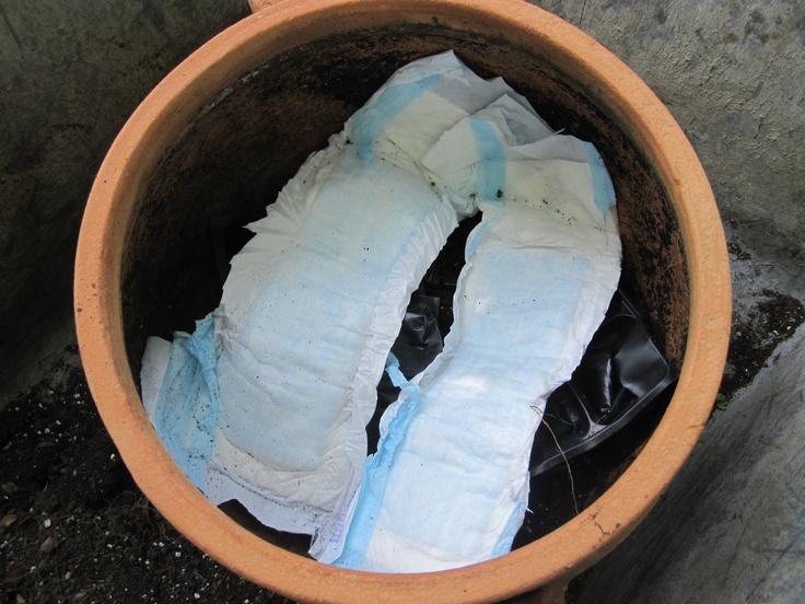 Cut the elastic leg edges off, lay diapers in your pots with absorbent side up. The diapers will keep your soil moist for days!