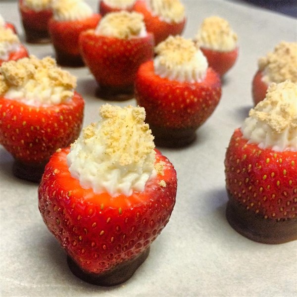 Strawberries are stuffed with a cream cheese filling for a cute two-bite dessert. 