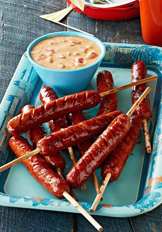 Dip hot dogs on a stick into queso sauce plus 15 genius hot dog hacks!