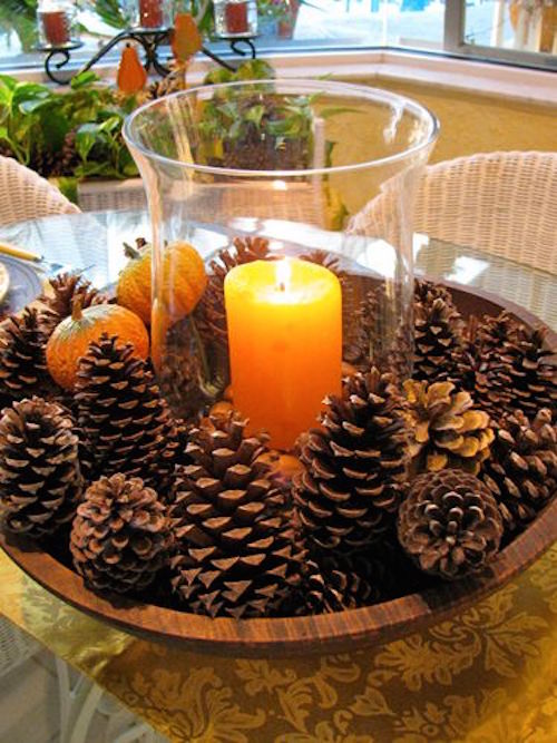 Need a centerpiece that takes less than five minutes to make? Just place pine cones in a large bowl and place a hurricane vase holding a candle in the middle.
