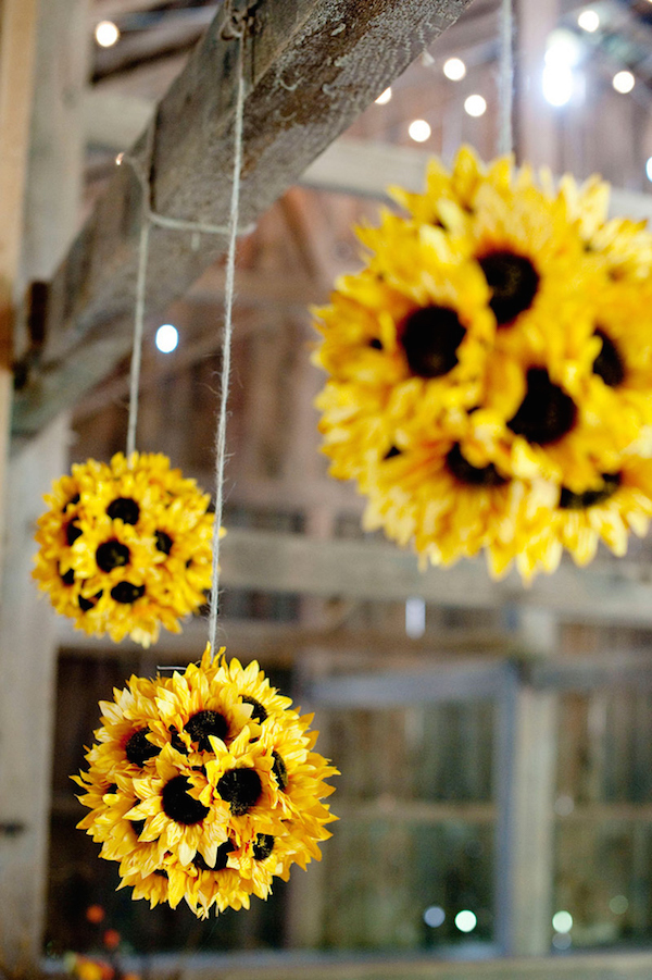 Hang sunflowers around your home during the fall using either a styrofoam ball or wiffle ball, fake sunflowers (with the stems cut off), and hot glue. Easy and stunning!