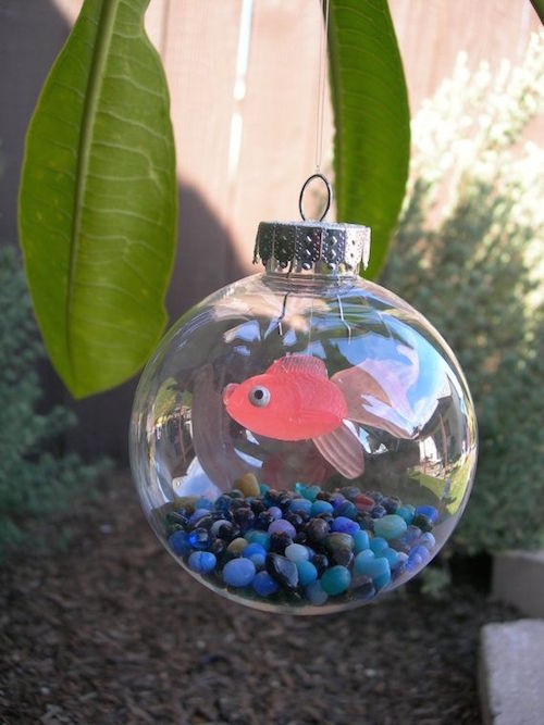 Make a fish bowl ornament with small aquarium rocks, fishing line, and a rubber fish (found at a pet store). CUTE! 