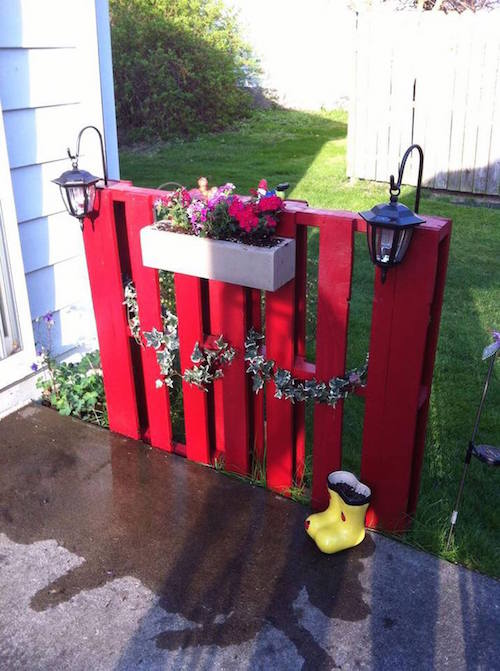 DIY Pallet fence. So cute! Hang lanterns and a flower box. Great idea -
