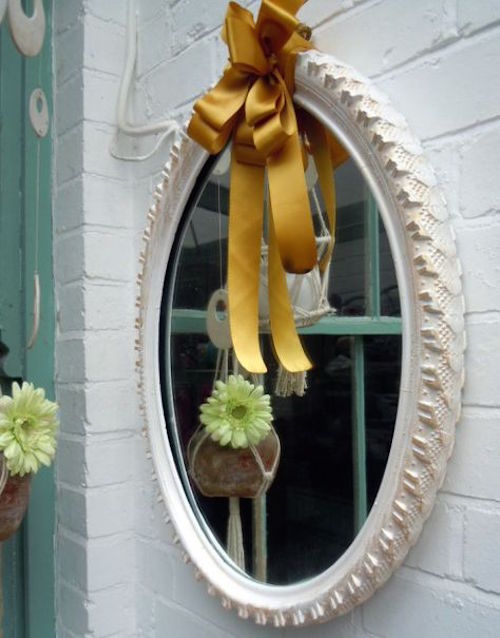 This is a mirror made with an old tire (no really it is- look closely!).