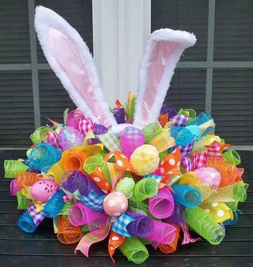 Awww... how sweet! Click the picture to have one made or use this picture as an inspiration to make your own bunny ear wreath (or centerpiece)