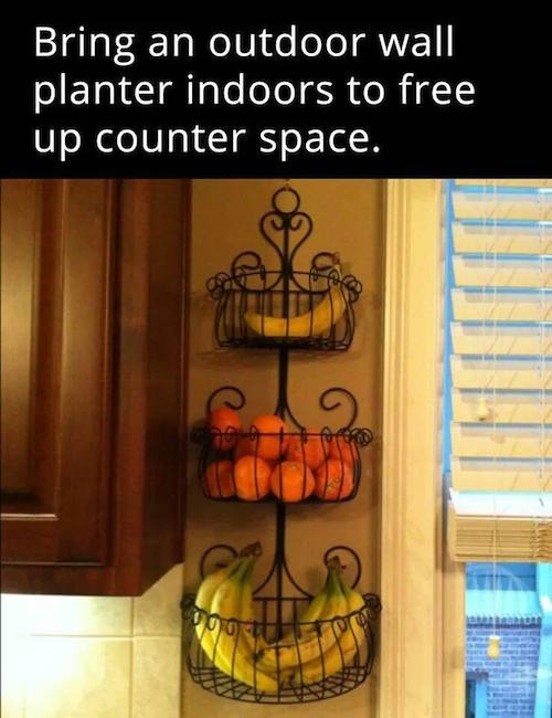 Hang an outdoor planter inside to clear up counter space and organize things. So smart!