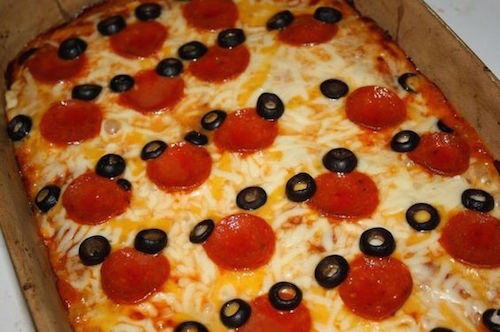 Use pepperoni and olives to make a Mickey pizza - so easy! 