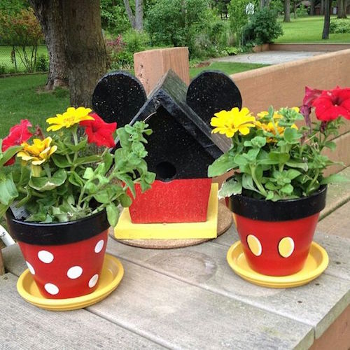 Plant a Disney garden by painting pots and a bird feeder with yellow, white, black, and red paint. Just glue some little ears to the top of the bird house. Cute! 