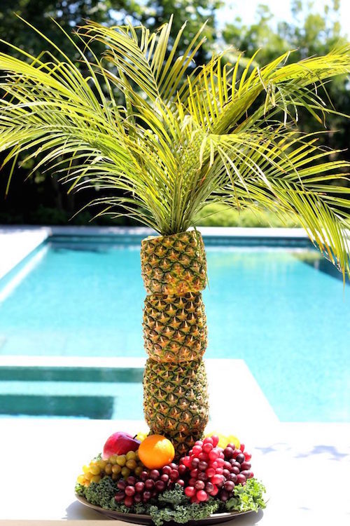 DIY stacked pineapple fruit tray - wow! This is such a neat summer party centerpiece idea! 