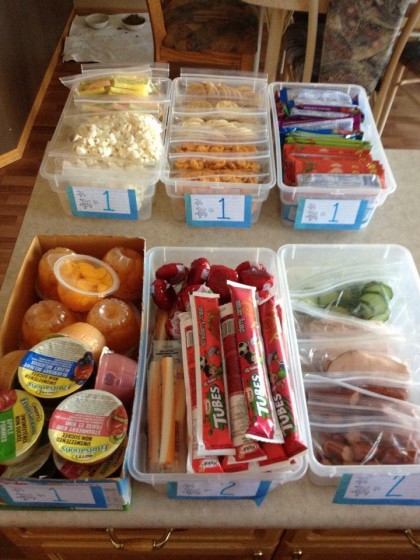 Tips for making school lunches (from a mother of 8) - DIY lunch bins. There is a number on the front of each bin which tells you how many items to pack. Then the kids can choose what items they want in their lunches. So smart!