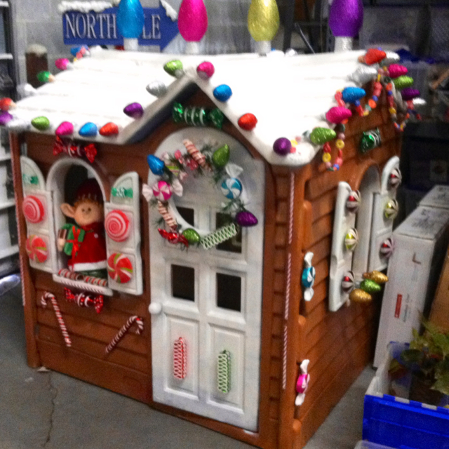 Turn an old plastic outdoor playhouse into a fun holiday gingerbread house