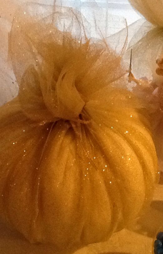 Pumpkin wrapped in gold shimmer tulle.