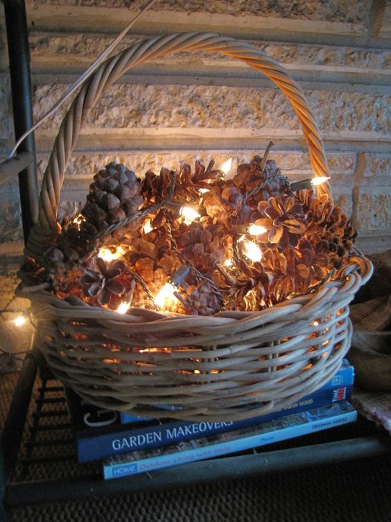 Put pinecones in a basket and gently wrap white Christmas lights throughout. You know what would be even easier and prettier? Twinkle lights around the pinecones! 