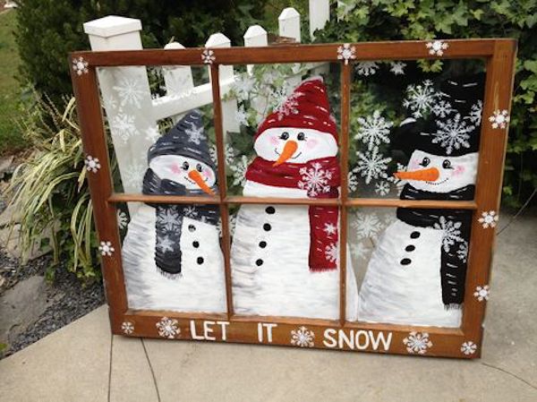 A blustery snowman scene made out of an old window!