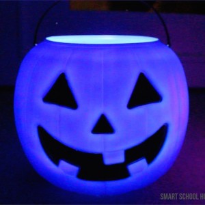 Glowing Pumpkin Pails - Decorate for Halloween in 30 seconds by setting out these glowing pumpkin pails! I got the colorful pumpkins for one dollar. They are SO ADORABLE!