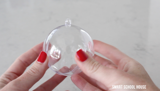 How to make a Mason Jar Lid Snow Globe for Christmas using a clear plastic ornament. ADORABLE! Easy for everybody to do! DIY Christmas gift in a jar idea.