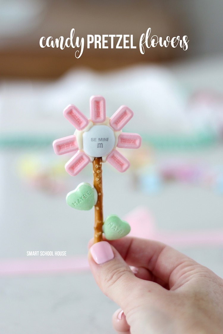 Candy Pretzel Flowers! A DIY Valentine's Day idea. flowers made with a pretzel stick, Valentine's Day candies, and colorful Pez. 