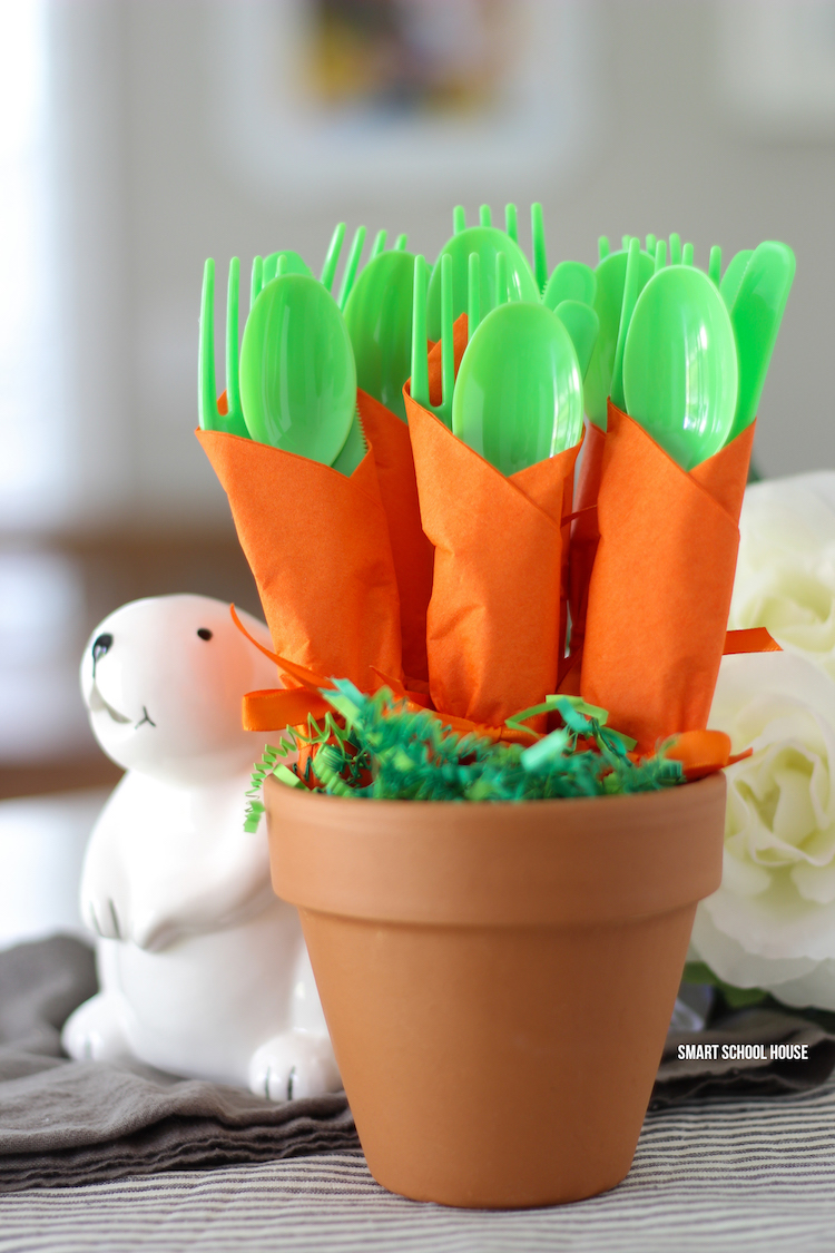 Carrot Napkin Utensils - DIY bushel of carrots for Easter utensils! Green utensils wrapped in an orange napkin to look like carrots.