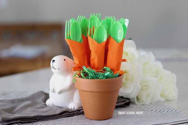 Carrot Napkin Utensils - DIY bushel of carrots for Easter utensils! Green utensils wrapped in an orange napkin to look like carrots.
