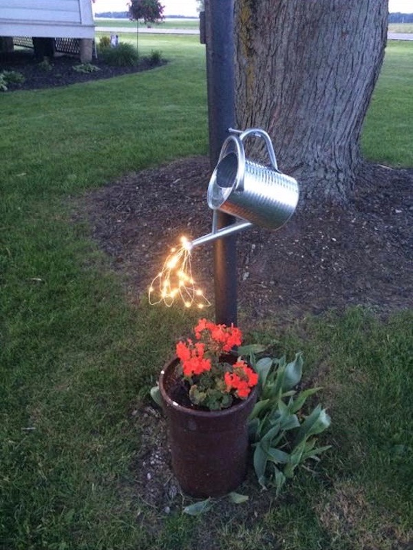 Glowing Watering Can Pouring Out Lights