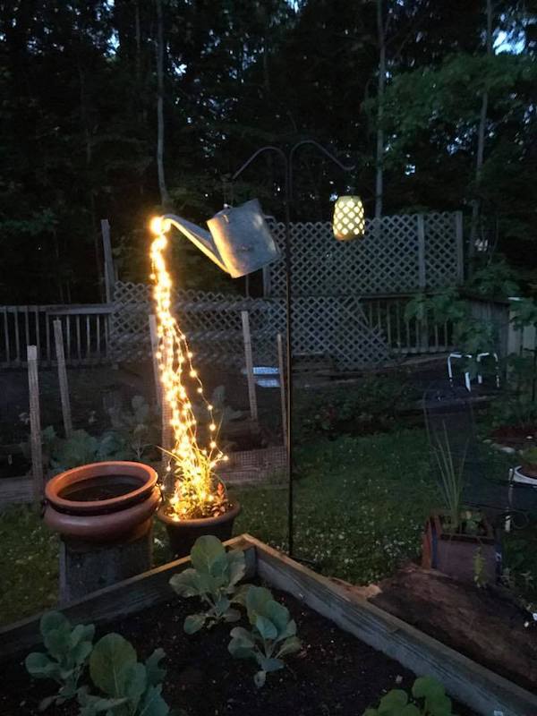 Glowing Watering Can Pouring Out Lights