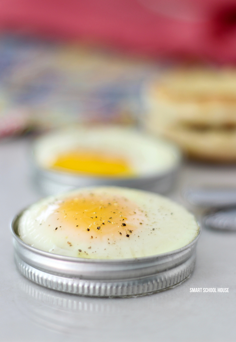 Recipe for baking eggs in a mason jar lid. SO EASY and for busy mornings or feeding a large family. The baked eggs slide right out! I would put mine over an english muffin. Recipe for making mason jar lid eggs in the oven