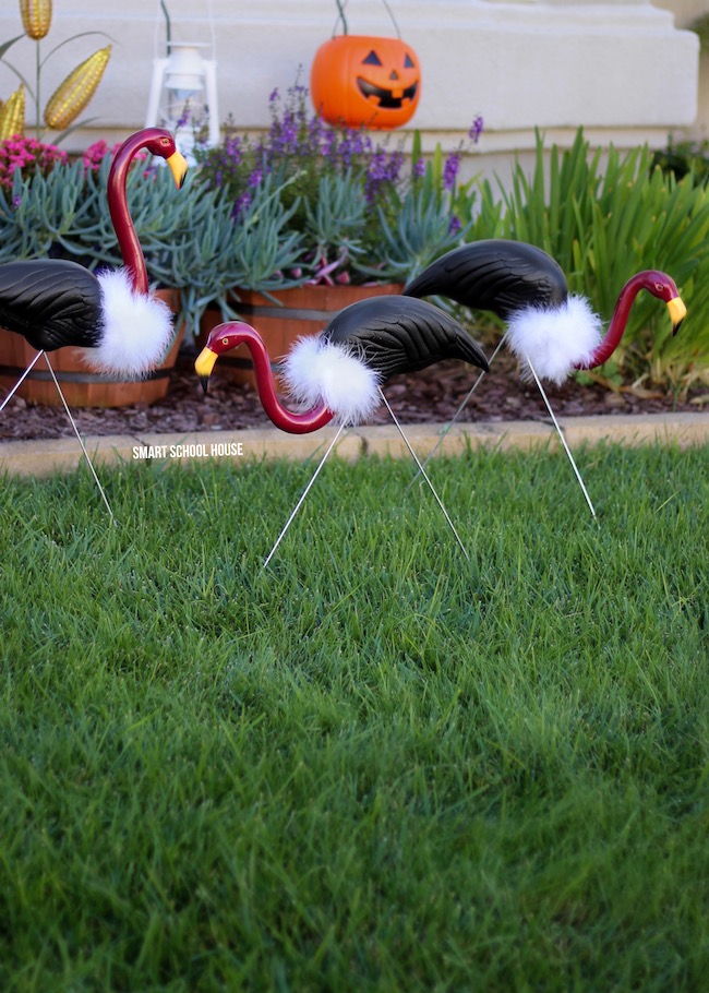 How to Make Flamingo Vultures - Turn pink lawn flamingos into vultures using some spray paint and a white boa around the neck. DIY flamingo buzzards.