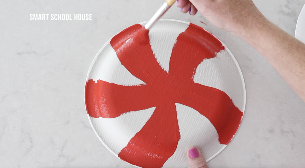 Painting a lollipop on a plate