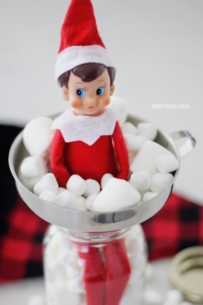 Elf on the Shelf in a Jar of Marshmallows for Christmas. #ElfOnTheShelf #ElfOnTheShelfIdea #ElfOnTheShelfIdeas #EasyElfOnTheShelfIdea