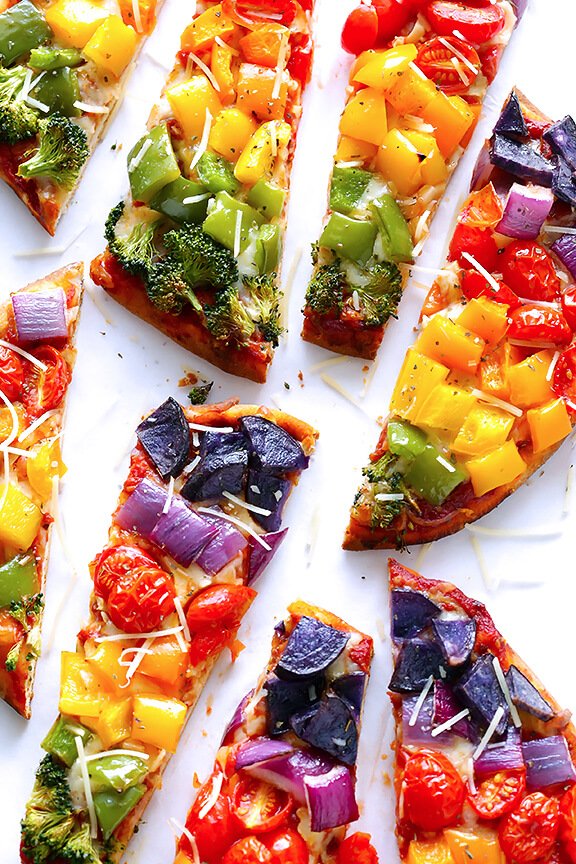 Rainbow flatbread veggie pizzas! You can make the pizzas with just about any colorful ingredients you have on hand, including pepperoni or sausage, or chicken if you really want to add some meat.