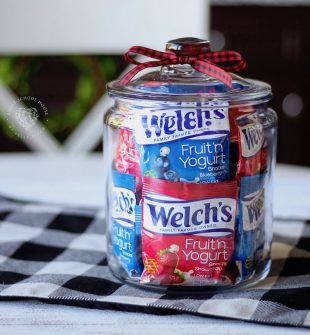 Fruit Snacks in a Jar - colorful fruit snack bags stacked in a clear jar for easy access and pretty organization of kids' snack food.
