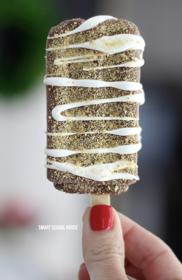 FROZEN S'MORES! Fudgsicles mixed with s'mores are such a tasty, quick, and easy cold treat for summer. Perfect for cooling off and curing your chocolate cravings this summer. 