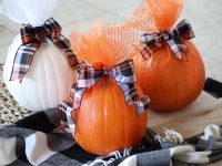 Pumpkins Wrapped in Mesh. A no-carve pumpkin decorating idea!I love how the pumpkins sparkle and look all dressed up without any carving. #pumpkindecor #decoratingwithpumpkins #DIYHalloweenDecorations #DecoMeshPumpkin