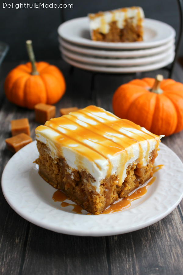 Pumpkin Poke Cake - The ultimate fall dessert! A pumpkin spice cake is drizzled with caramel sauce, frosted with a decadent cream cheese frosting and topped with even more caramel sauce! You'll love every single morsel of this uber moist, delicious cake!