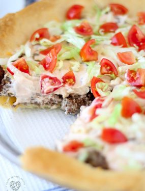 Taco Pie. An easy recipe for dinner! Fluffy dough baked in a pie dish then loaded with beef, cheese, and more. #TacoPie #DinnerIdeas #EasyDinner