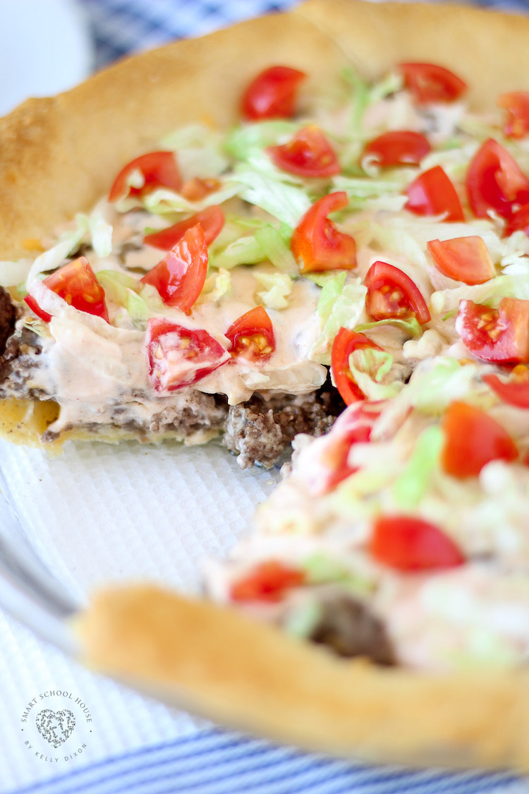Taco Pie. An easy recipe for dinner! Fluffy dough baked in a pie dish then loaded with beef, cheese, and more. #TacoPie #DinnerIdeas #EasyDinner