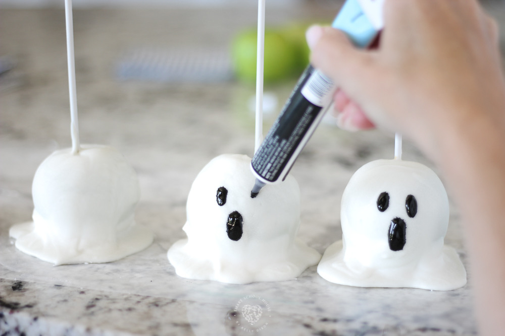Making ghosts apples for Halloween