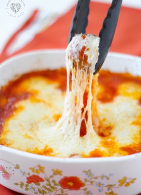 Meatball Parmigiana is cheesy meatballs with tomato sauce baked right in the oven, no mess or frying! Good enough for a fancy dinner to serve for a holiday and is also kid friendly. You’ll Be Head Over Heels For This Baked Meatball Parmesan Casserole