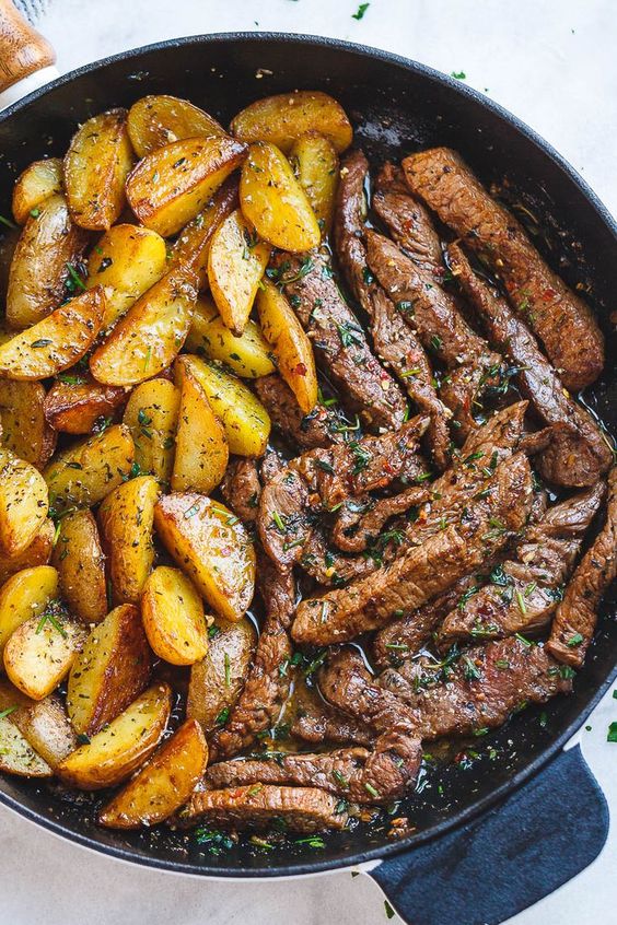 Garlic Butter Steak and Potatoes Skillet – This easy one-pan steak and potatoes recipe is SO simple and SO flavorful. Juicy steak and crisp-golden potatoes are pan-seared and cooked to perfec