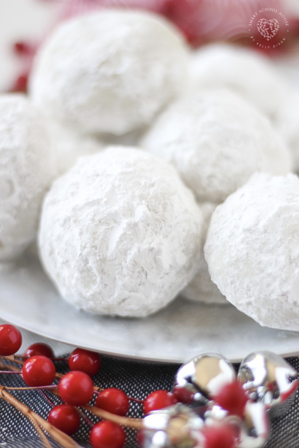 Our Snowball Cookies are a Christmas favorite! They have a buttery vanilla flavor surrounded by soft and snowy powdered sugar. These melt in your mouth cookies are a beautiful addition to your holiday cookie plates and dessert tables.