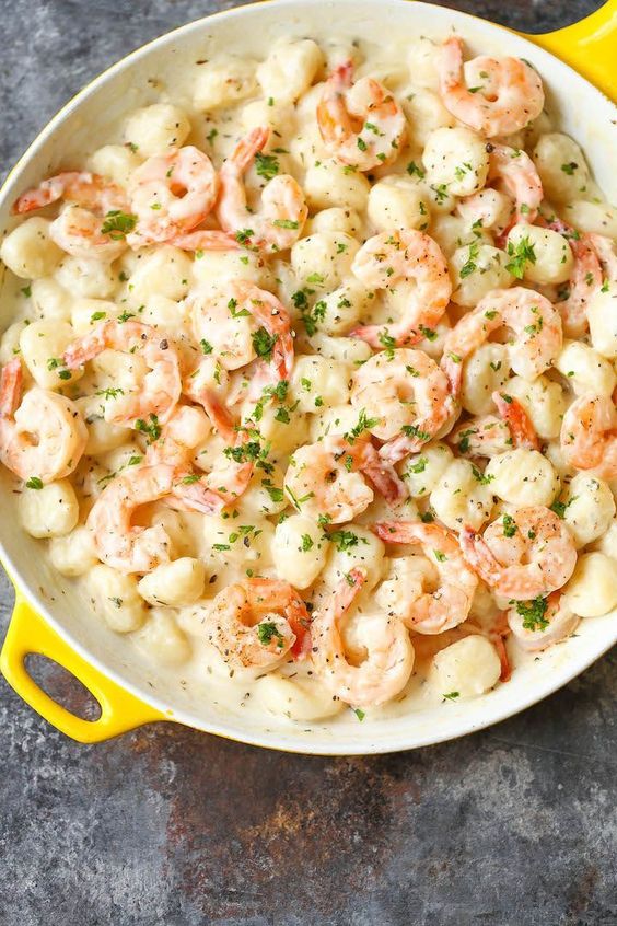 Shrimp and Gnocchi with Garlic Parmesan Cream Sauce - Light, airy gnocchi tossed with tender shrimp and the most amazing cream sauce you'll want to drink!