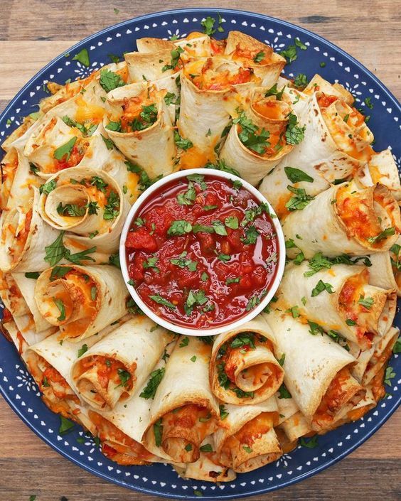 Blooming Quesadilla Ring - Shredded chicken, onion, red bell pepper, jalapeño, taco sauce, taco-size tortillas, shredded cheddar cheese, and shredded monterey jack cheese.