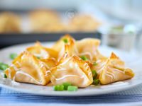 Buffalo Chicken Wontons. Baked, not fried! Creamy buffalo chicken drizzled in dressing! Done in 12 minutes.