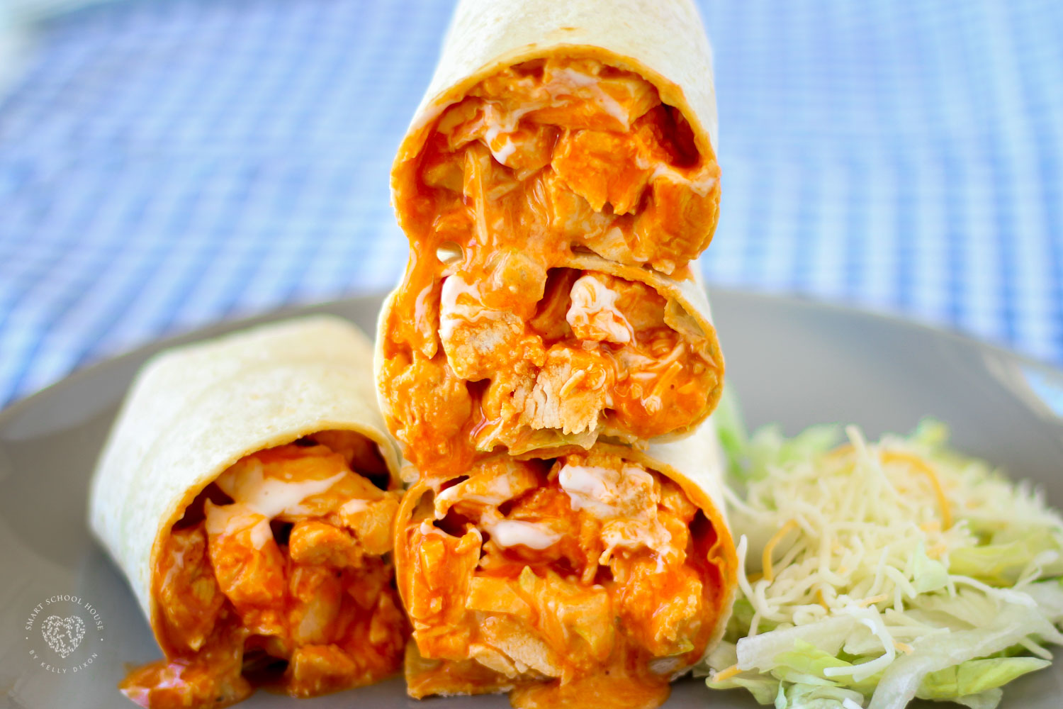Drizzled with delicious ranch dressing and stuffed with shredded lettuce, these Buffalo Chicken Wraps are bursting with flavor and made in just 30 minutes!